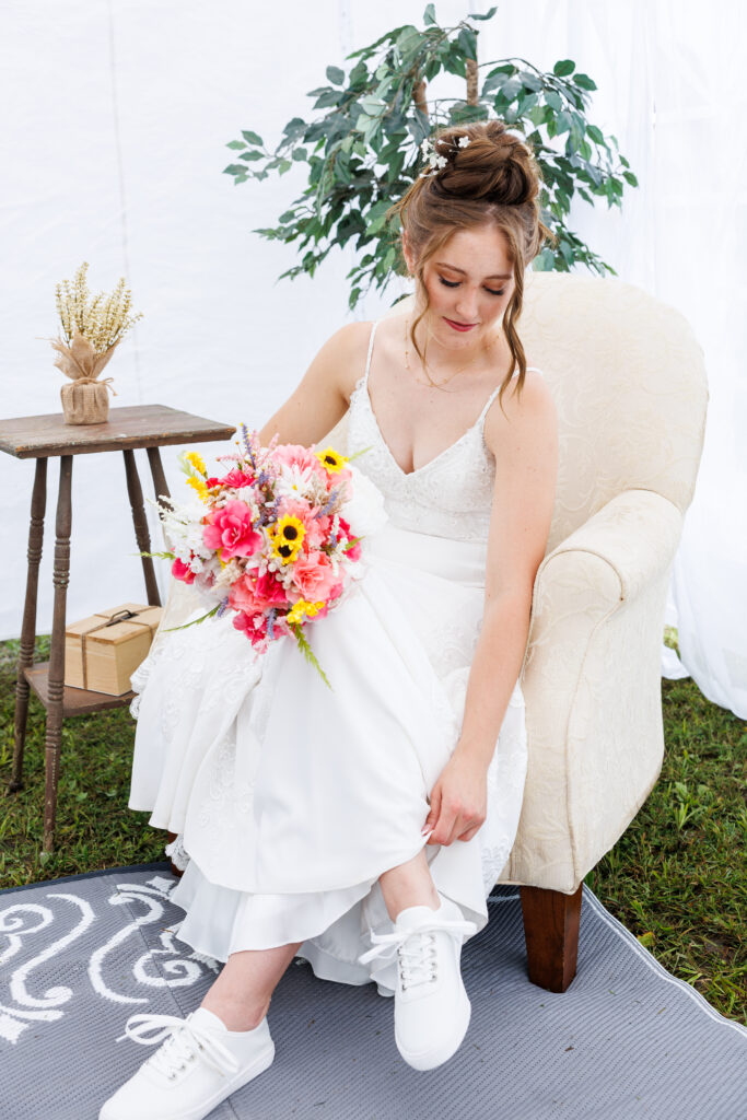 Outdoor wedding venue at Pleasant Pastures Events in Central MN featuring giant oak trees, ponds, outdoor ceremony site, reception tent, concrete dance floor, grain bin bar, garden like setting, rustic outdoor