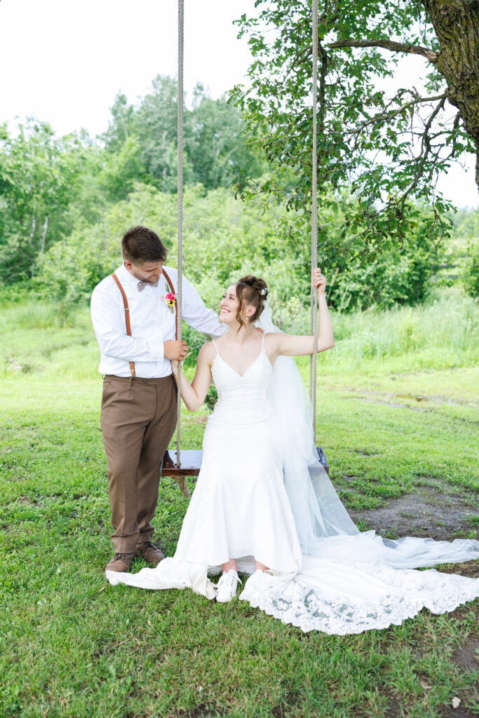 Outdoor wedding venue at Pleasant Pastures Events in Central MN featuring giant oak trees, ponds, outdoor ceremony site, reception tent, concrete dance floor, grain bin bar, garden like setting, rustic outdoor