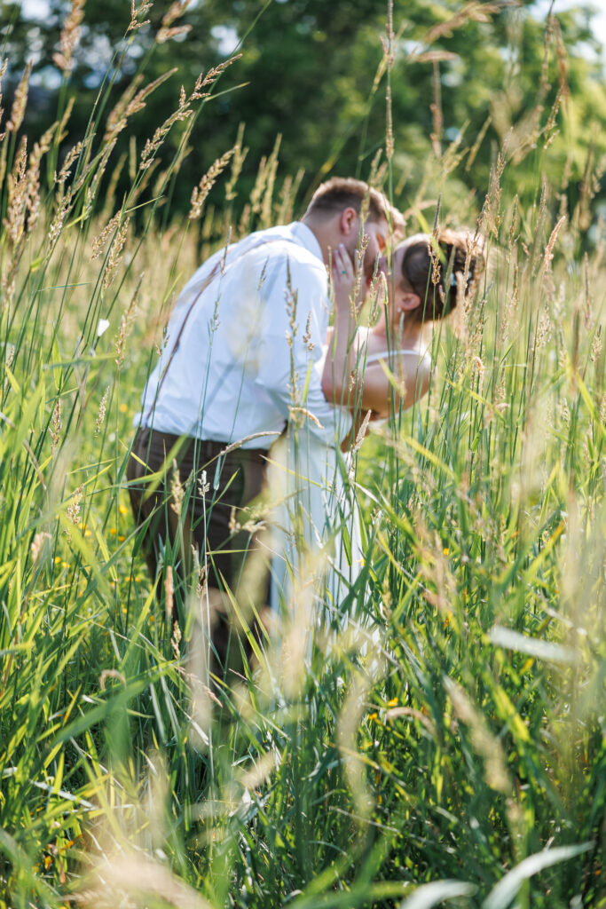 Outdoor Wedding Venue at Pleasant Pastures Events in Central MN featuring pond, oak tree, outdoor ceremony site, reception tent, grain bin bar, for engaged couples