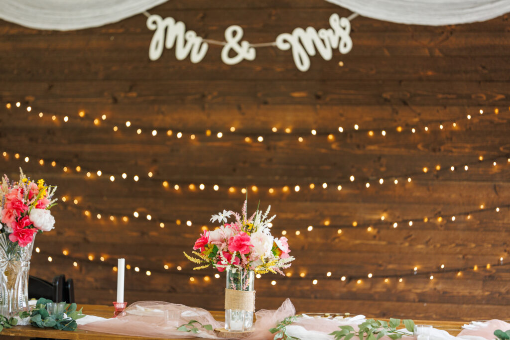 Outdoor wedding venue at Pleasant Pastures Events in Central MN featuring giant oak trees, ponds, outdoor ceremony site, reception tent, concrete dance floor, grain bin bar, garden like setting, rustic outdoor