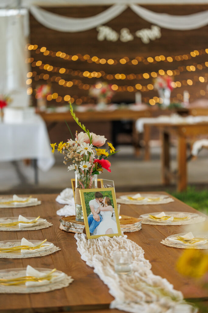 Outdoor wedding venue at Pleasant Pastures Events in Central MN featuring giant oak trees, ponds, outdoor ceremony site, reception tent, concrete dance floor, grain bin bar, garden like setting, rustic outdoor