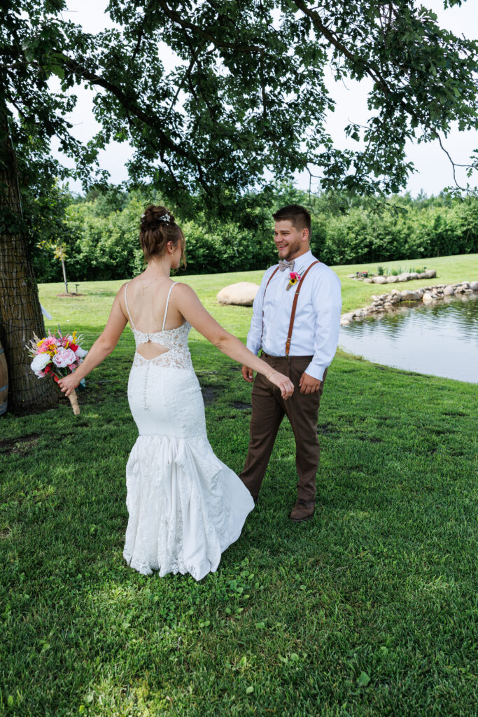 outdoor wedding venue at Pleasant Pastures Events in Central MN featuring an outdoor ceremony site, reception tent with concrete dance floor, ponds, water features, grain bin bar, rustic wedding venue for engaged couples